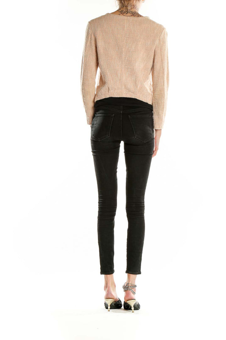 Back view of Humanoid blush textured zip-up cropped jacket