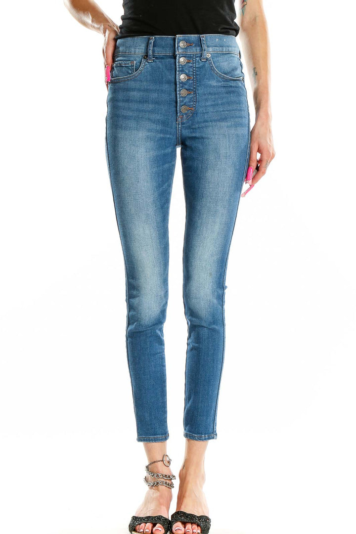 Front view of Express high-waisted skinny jeans in medium wash blue with button-fly