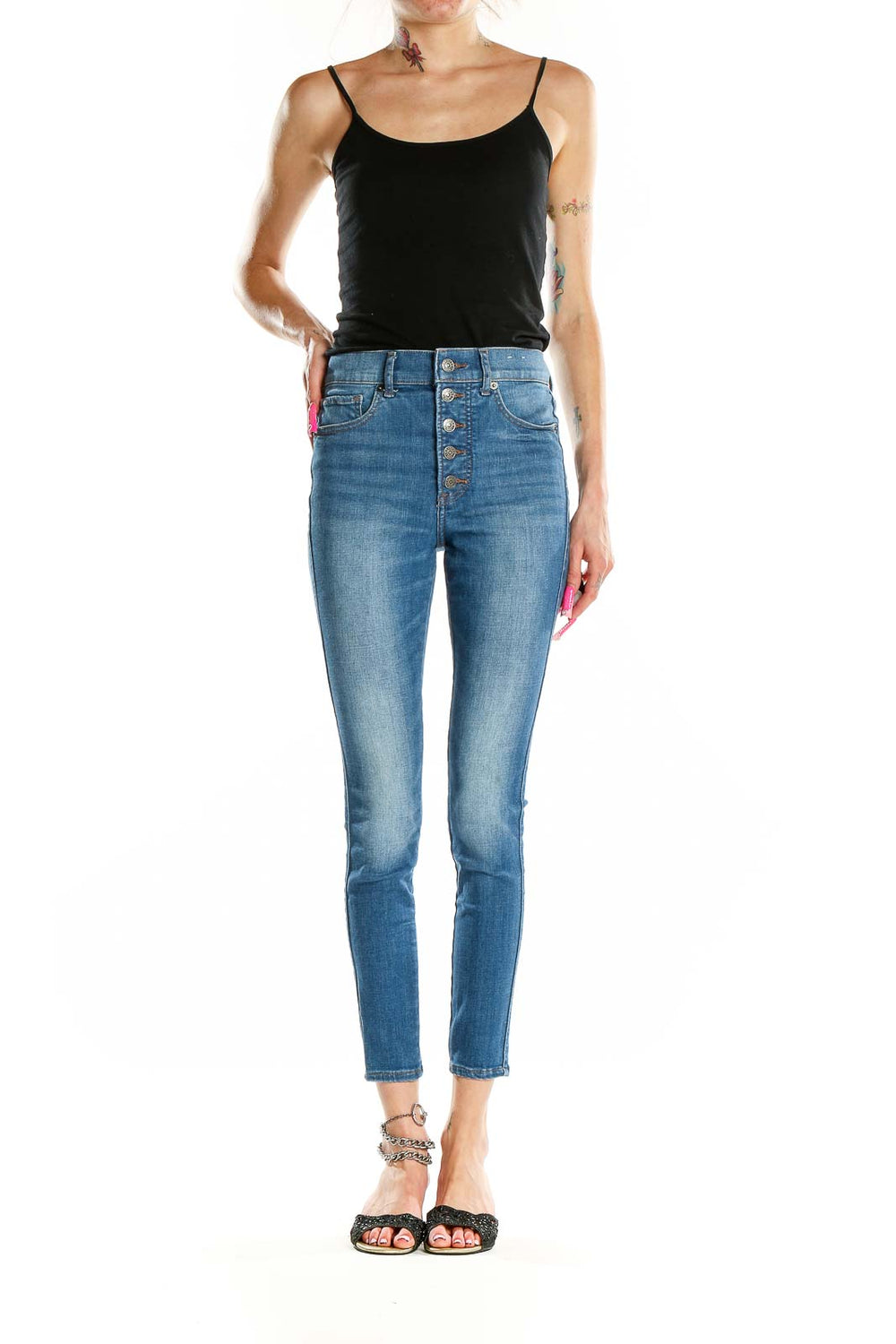 Front view of Express high-waisted skinny jeans in medium wash blue with button-fly