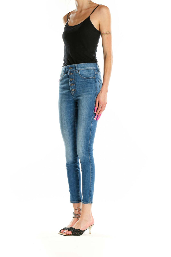 Front view of Express high-waisted skinny jeans in medium wash blue with button-fly