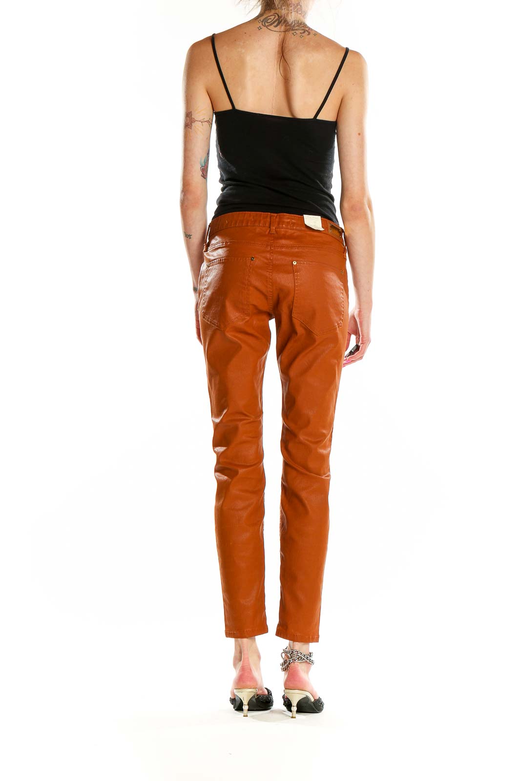 Side view of model wearing Zara Woman rust orange slim fit pants