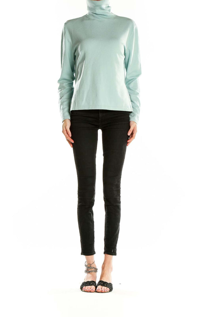 Front view of mint green Faconnable turtleneck sweater on model