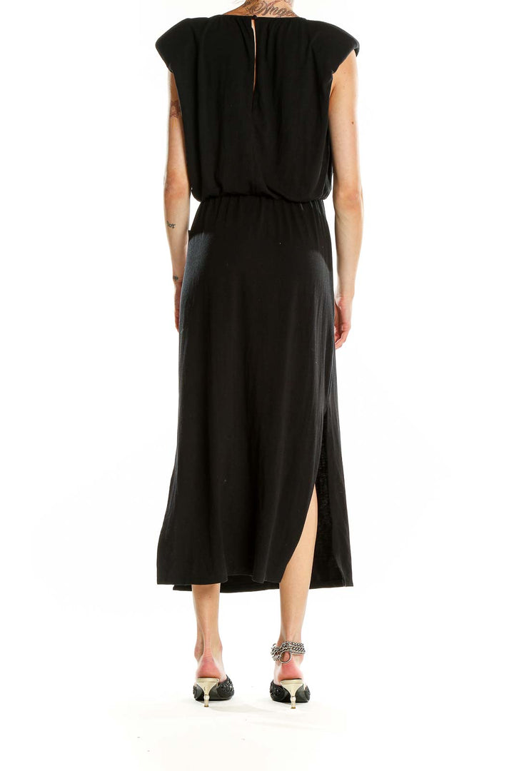 Side view of Wayf black maxi dress showcasing the elegant side slit