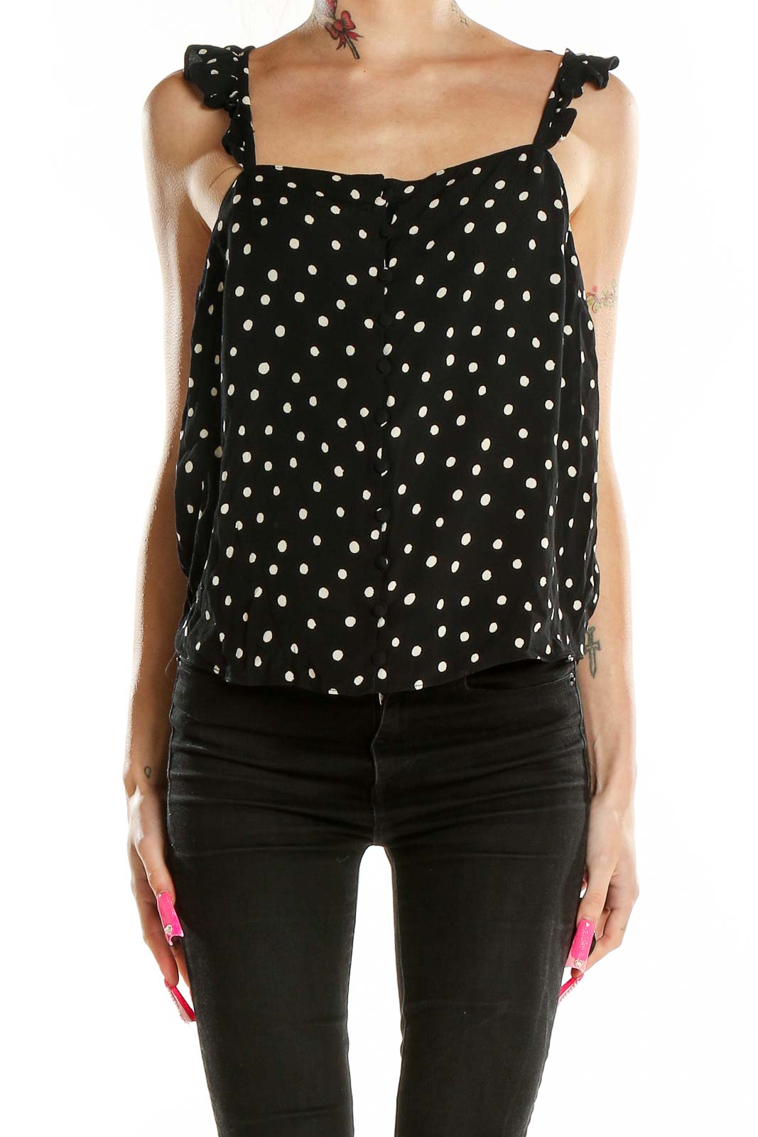 Front view of Madewell black polka dot tank top with ruffle straps