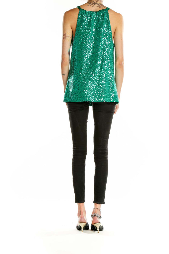 Side view of T Tahari green sequin sleeveless top showing length and fit