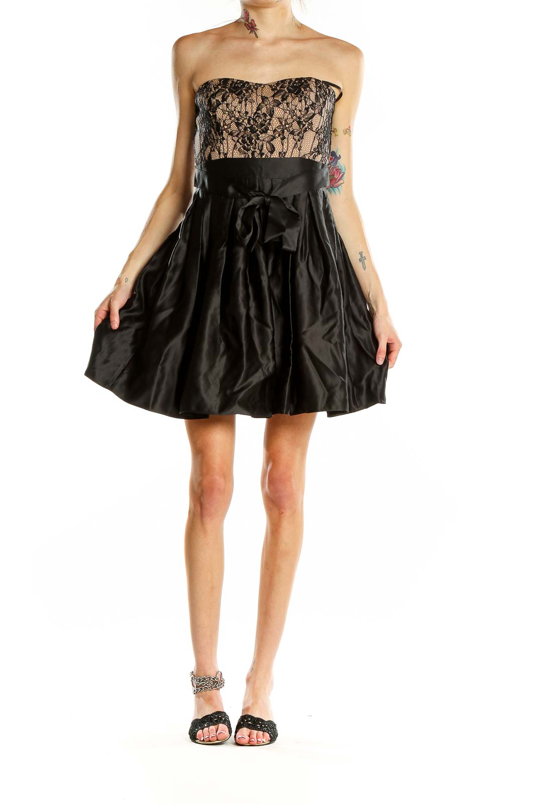 Front view of Aidan Mattox black lace strapless cocktail dress with nude underlay