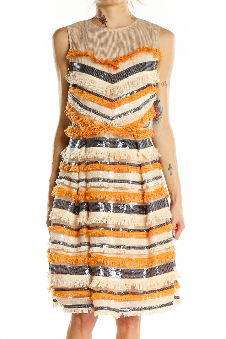 Front view of orange and cream striped fringe cocktail dress with sequin accents