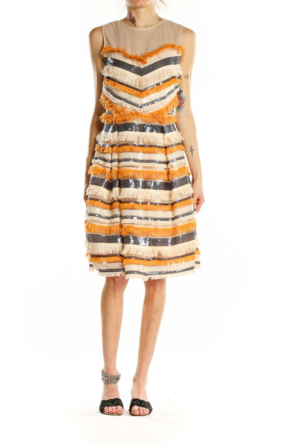 Front view of orange and cream striped fringe cocktail dress with sequin accents