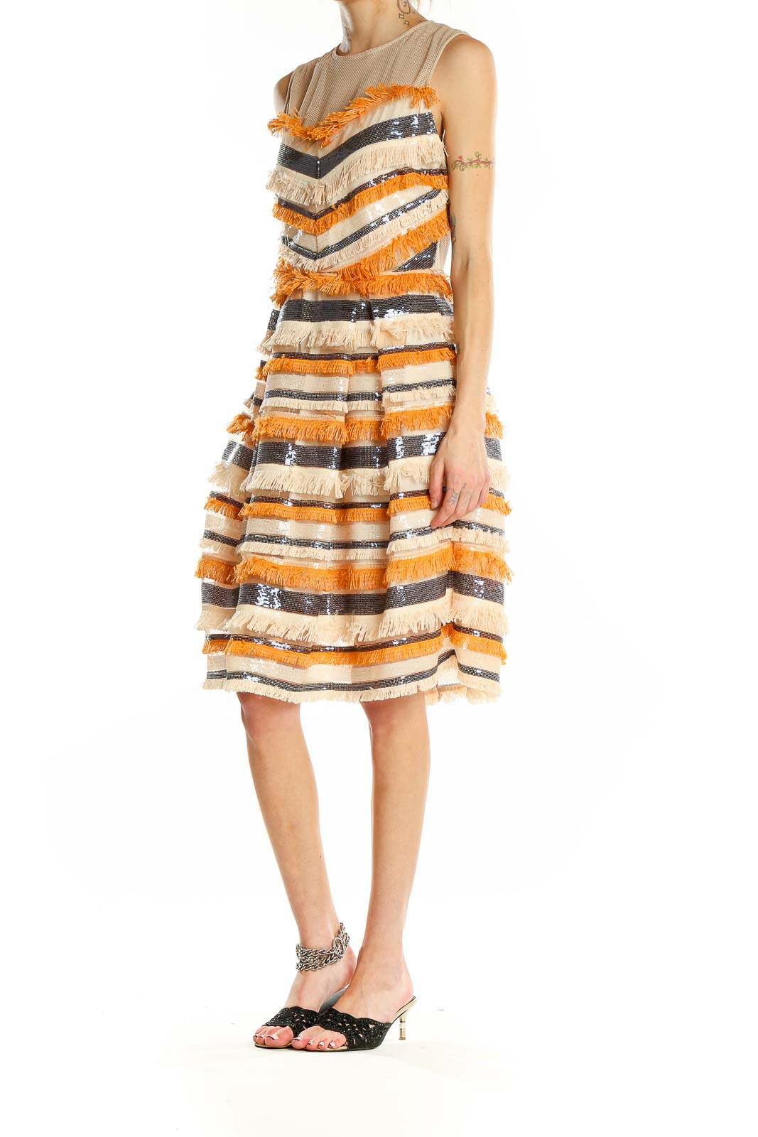 Front view of orange and cream striped fringe cocktail dress with sequin accents