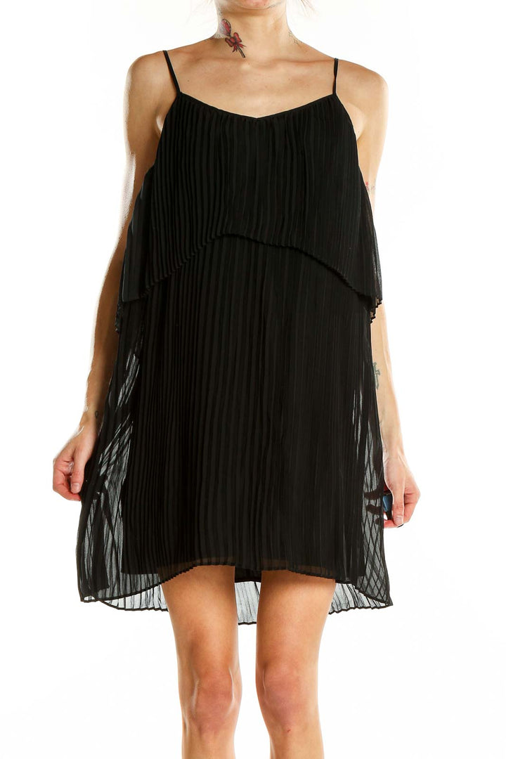 Front view of BCBGeneration black pleated chiffon mini dress with tiered design