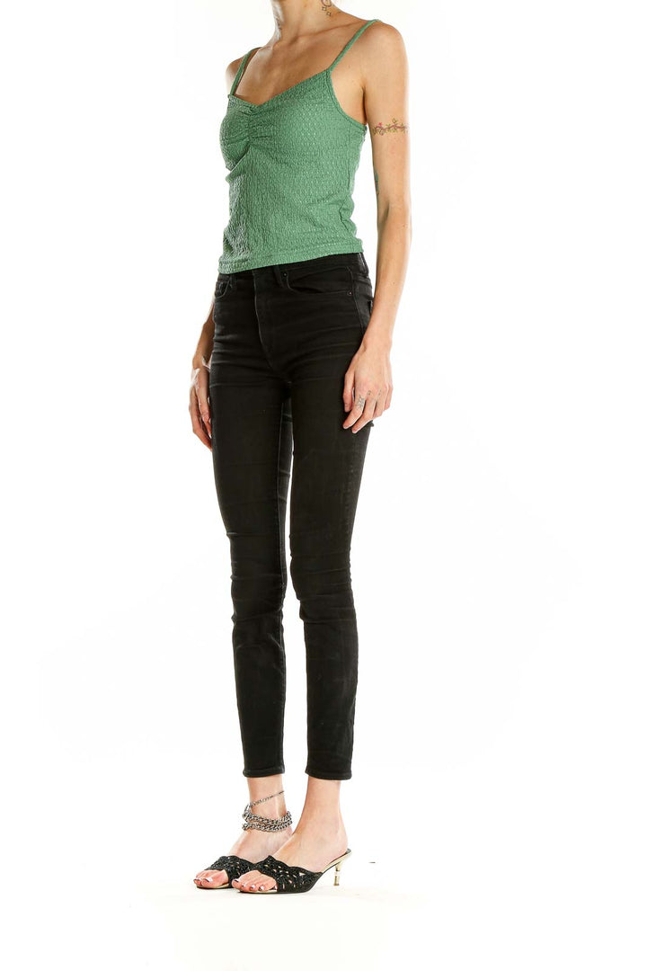 Front view of green textured cropped camisole top from Madewell