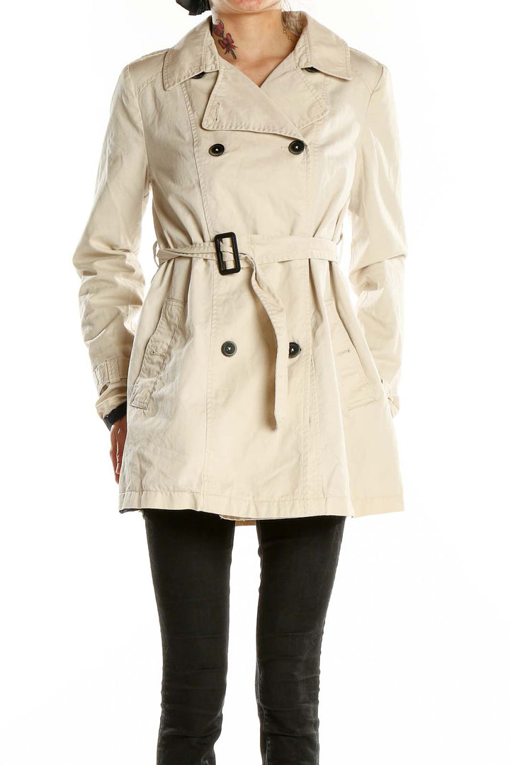Front view of Bershka Collection beige double-breasted trench coat with belt