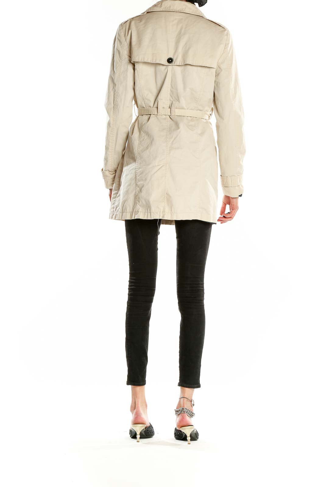 Back view of Bershka Collection beige trench coat on model with black pants