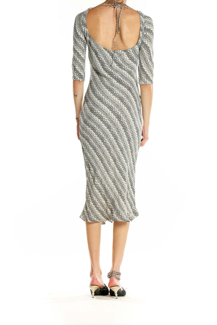 Side view of Tracy Reese gray striped rayon midi dress showing form-fitting silhouette