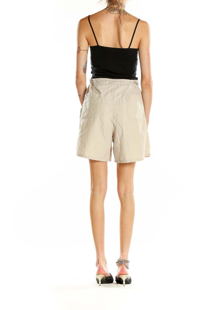 Side view of Columbia beige casual shorts showing pocket detail