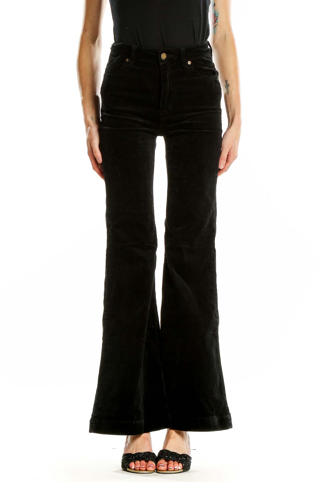 Front view of Rolla's black high-waisted flared jeans on model