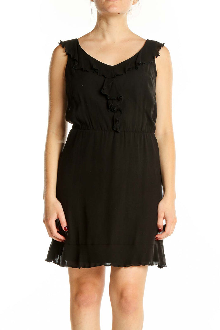 Front view of black ruffled sleeveless cocktail dress by White House Black Market