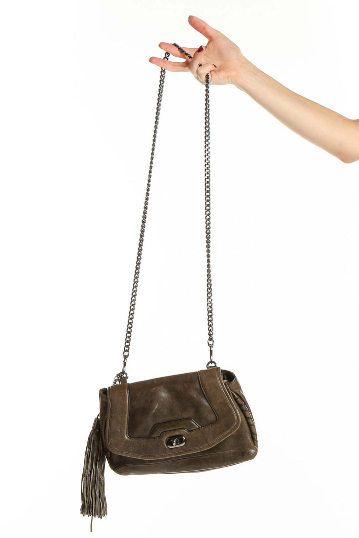 Front view of Cynthia Rowley brown leather crossbody bag with tassel
