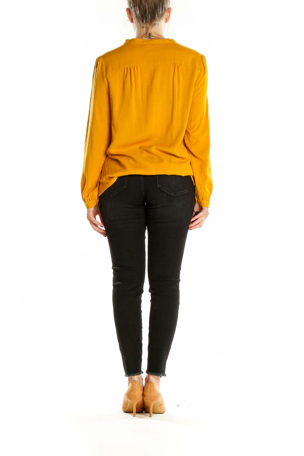 Back view of Anne Willi mustard long-sleeve blouse showing relaxed fit