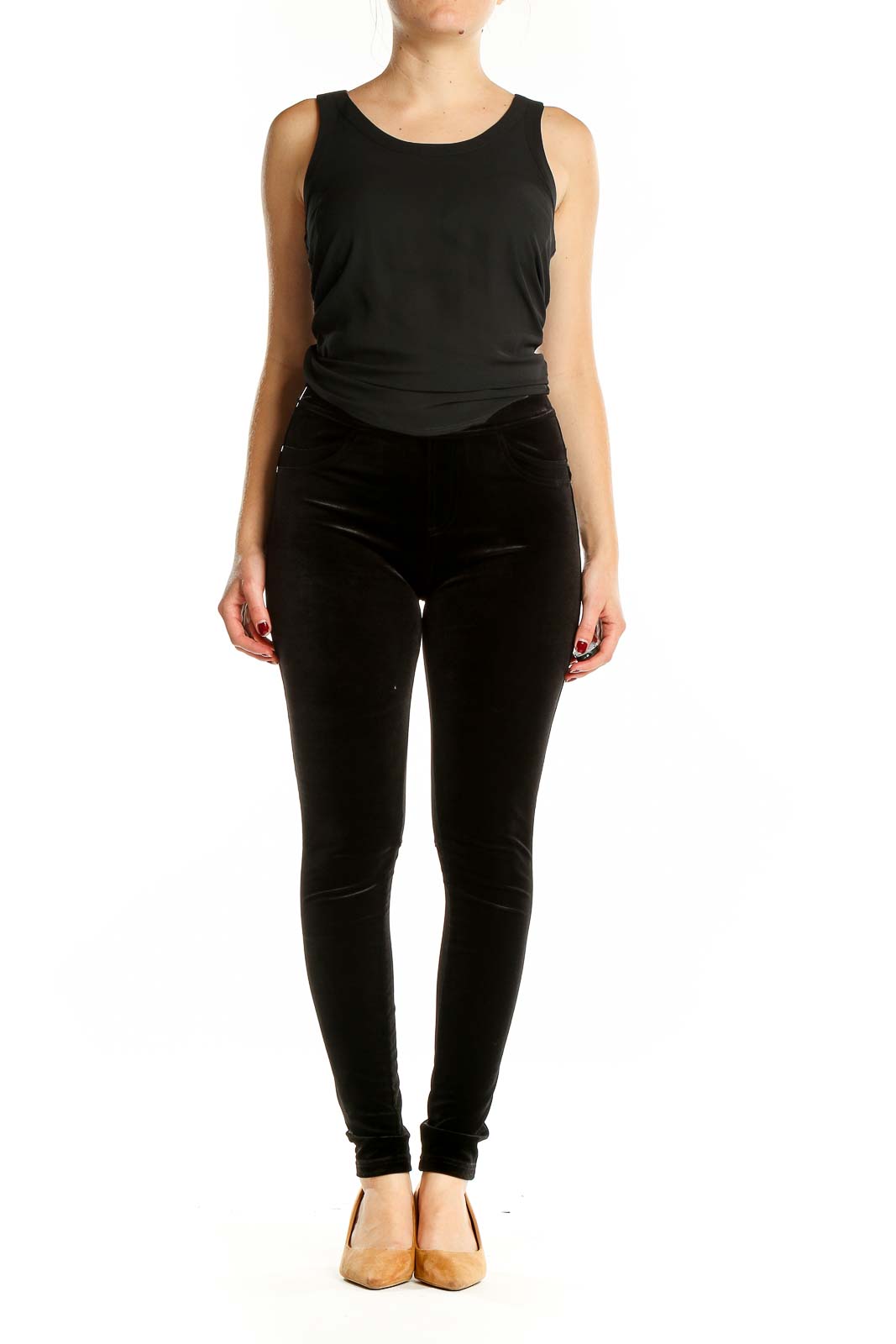 Front view of Sanctuary black velvet skinny pants on model
