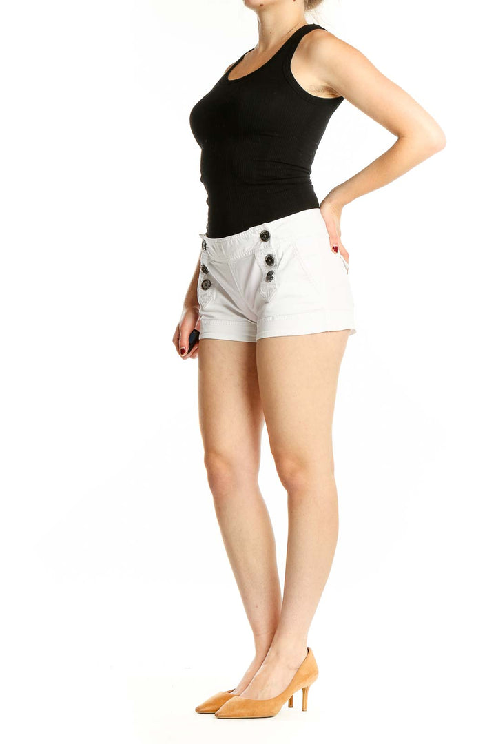 Front view of white Express shorts with button detail