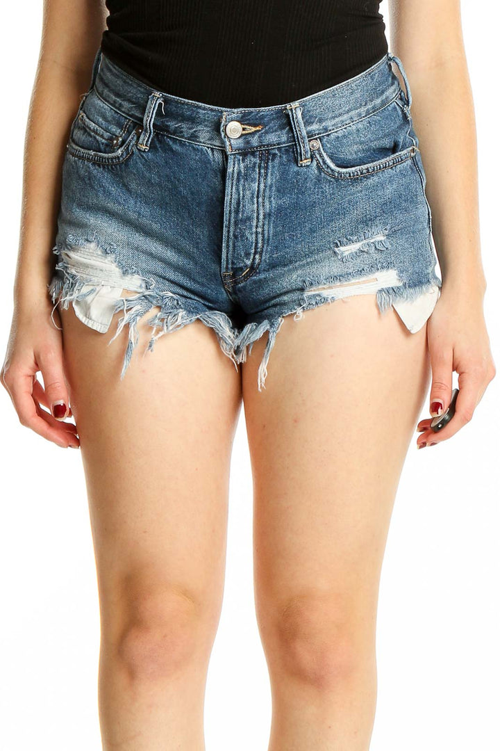 Front view of WE THE FREE blue distressed denim cutoff shorts