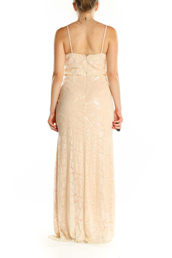 Back view of blush Slate & Willow sequin maxi dress showing spaghetti straps and fitted silhouette