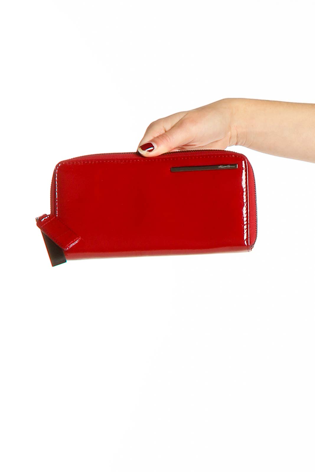 Red patent leather zip-around clutch by Kenneth Cole New York, front view