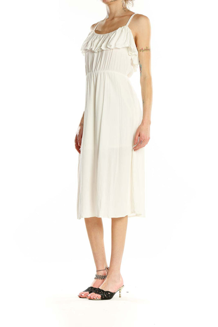 Front view of white Leith midi sundress with ruffled neckline and spaghetti straps