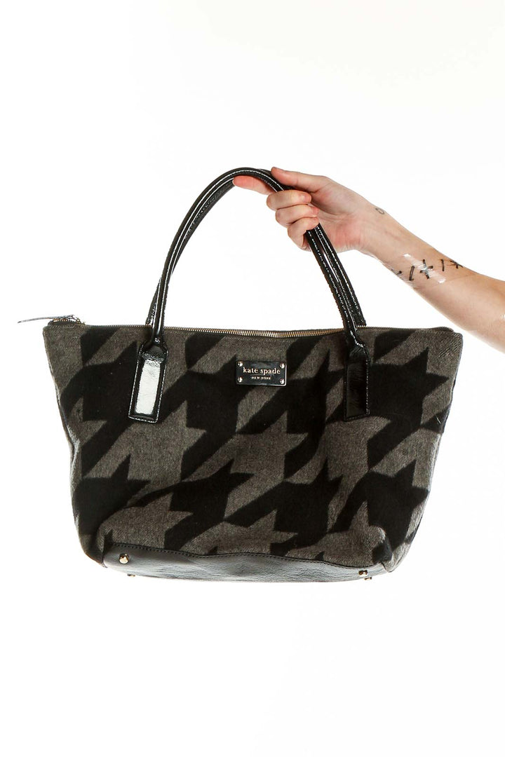 Front view of Kate Spade black and gray houndstooth tote bag with patent leather handles