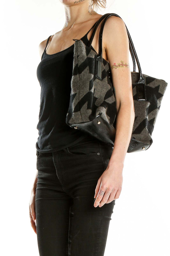 Front view of Kate Spade black and gray houndstooth tote bag with patent leather handles