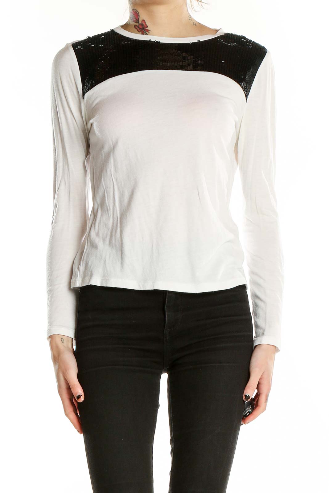 Front view of MICHAEL Michael Kors white long-sleeve top with black sequin shoulder panel