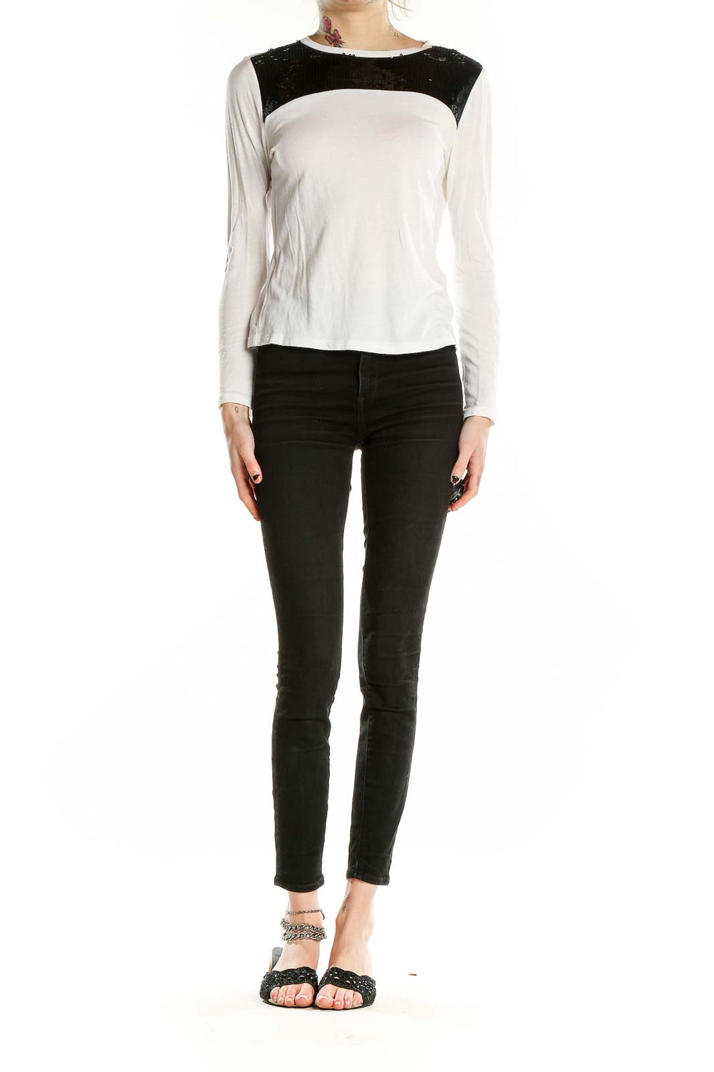 Front view of MICHAEL Michael Kors white long-sleeve top with black sequin shoulder panel