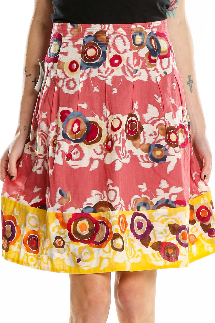 Front view of BCBG MaxAzria pink floral circle print pleated skirt