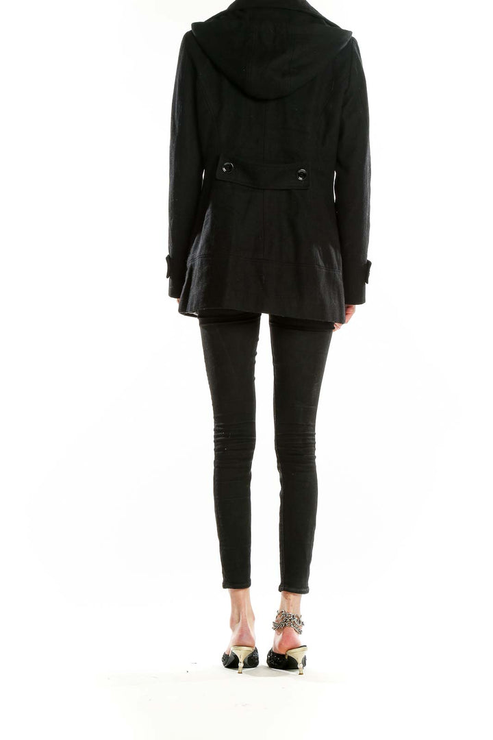 Back view of black Calvin Klein toggle coat on model