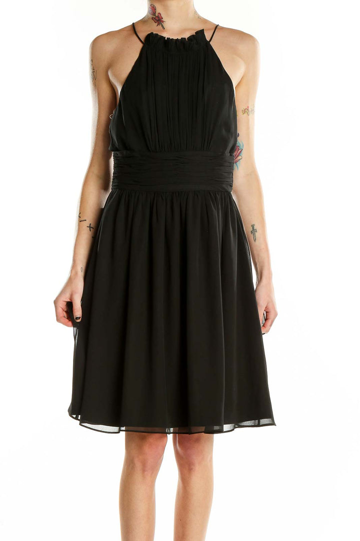Front view of black halter neck cocktail dress from White House Black Market