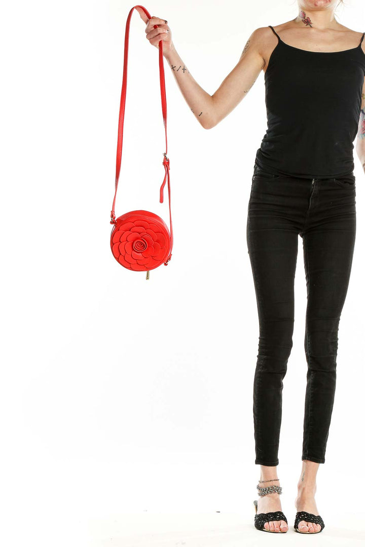 Front view of SilkRoll Red Floral Circular Crossbody Bag with long strap