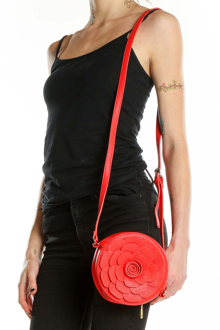 Front view of SilkRoll Red Floral Circular Crossbody Bag with long strap