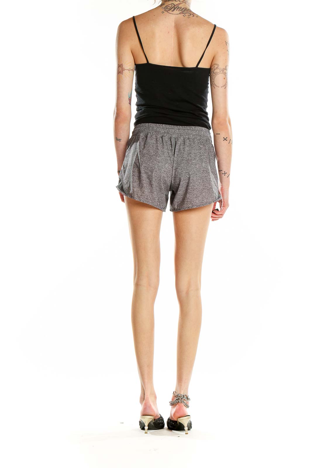 Back view of gray heathered Lululemon athletic shorts on model