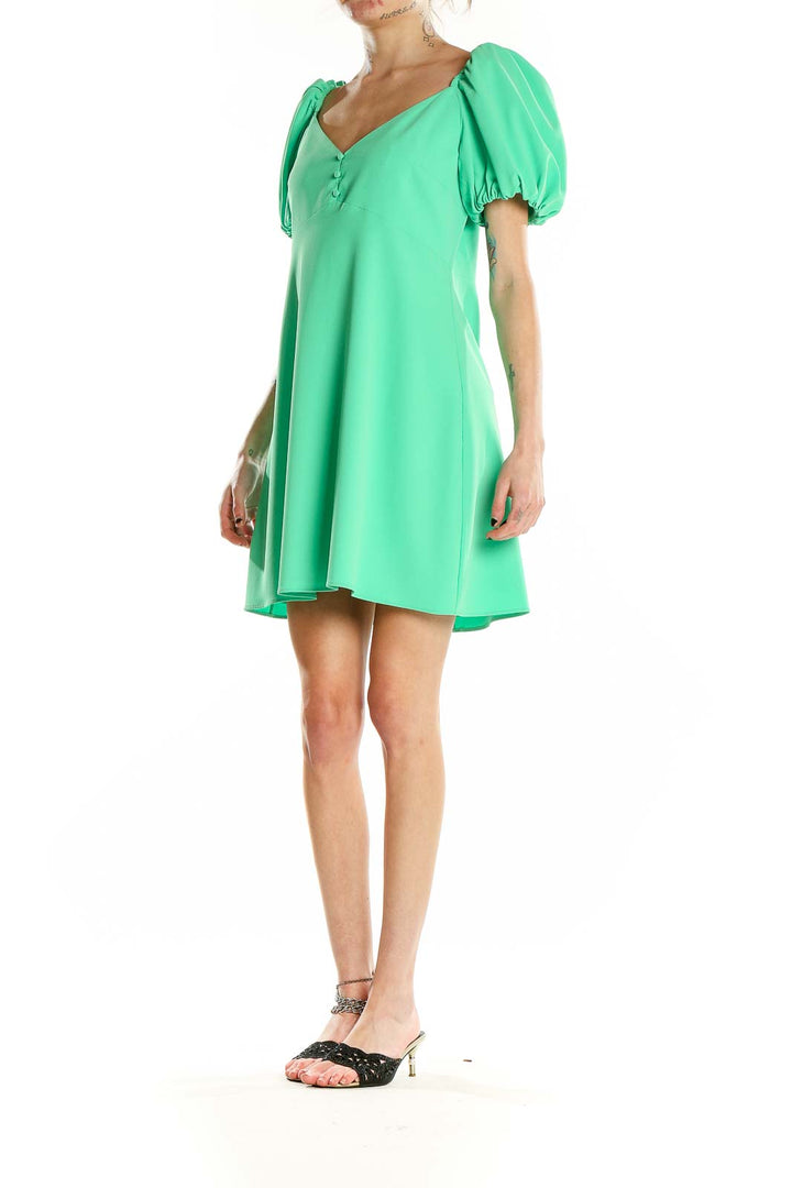 Front view of green puff sleeve mini dress by Alice + Olivia