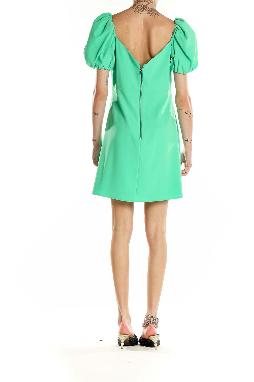 Back view of green puff sleeve mini dress by Alice + Olivia showing zipper closure