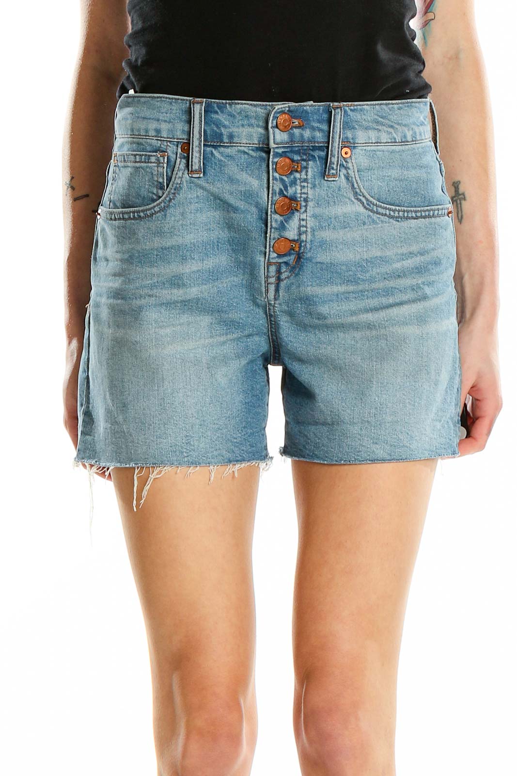 Front view of Madewell light blue denim shorts with button-front closure