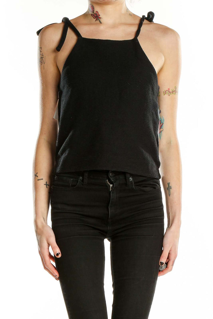 Front view of Madewell black cotton cropped tank top with tie straps