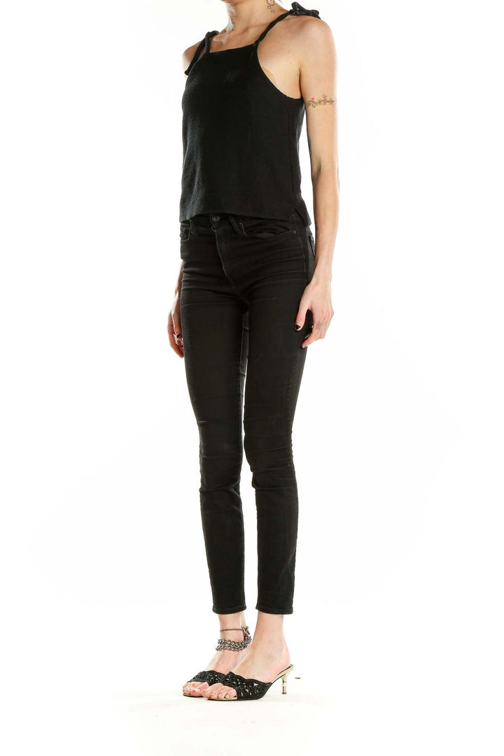 Front view of Madewell black cotton cropped tank top with tie straps