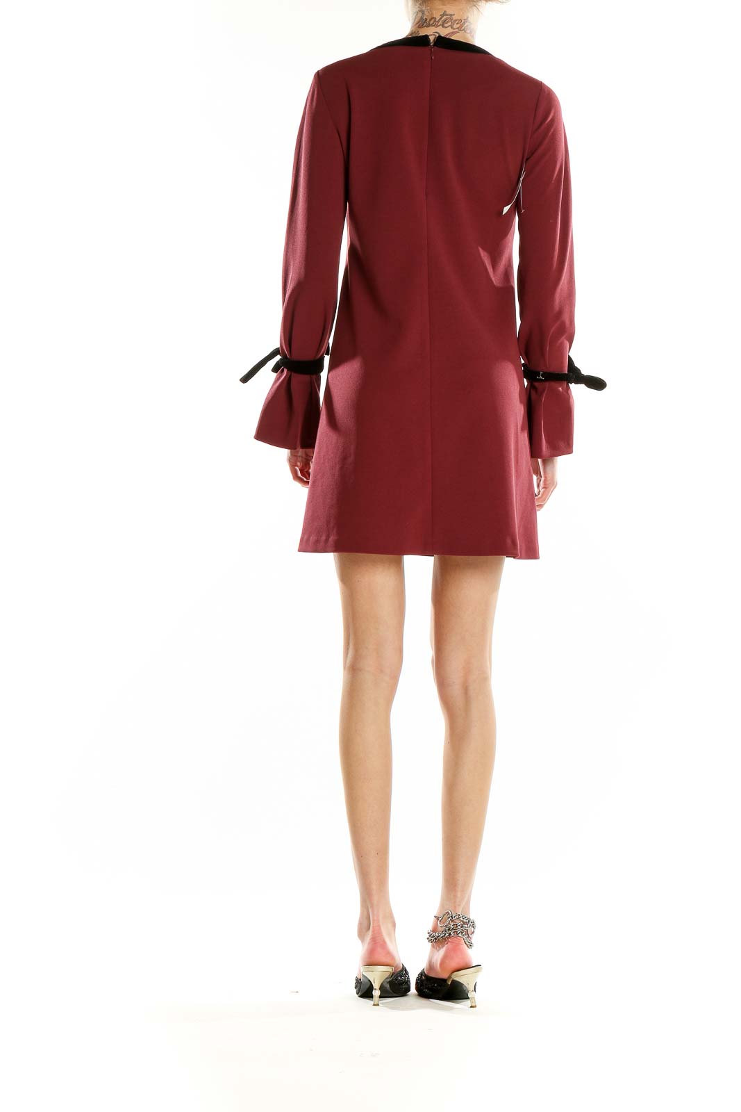Back view of burgundy Donna Morgan mini dress showing A-line silhouette and bell sleeves