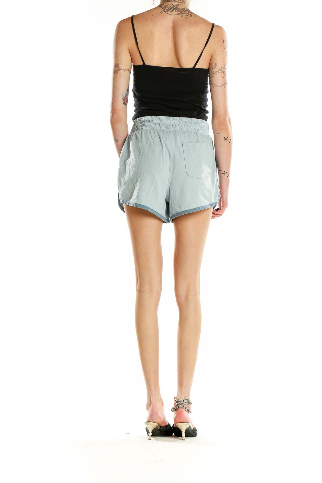 Back view of Everlane mint green organic cotton shorts showing relaxed fit