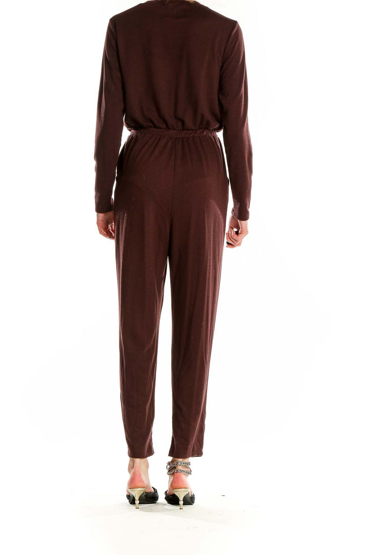 Back view of Gap brown long-sleeve jumpsuit showing elastic waistband