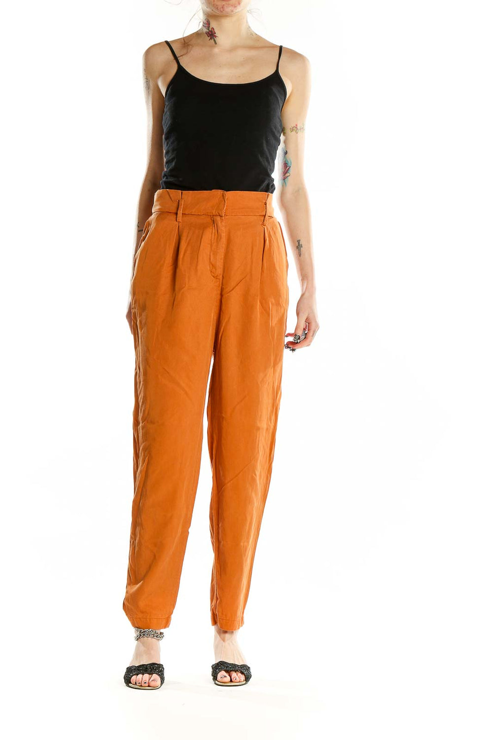 Front view of orange high-waisted pleated trousers by Socialite