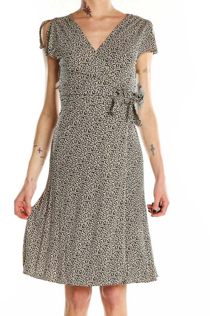 Front view of Ann Taylor black floral wrap midi dress with V-neckline and short sleeves