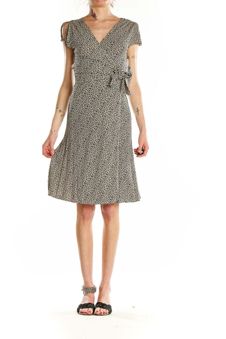 Front view of Ann Taylor black floral wrap midi dress with V-neckline and short sleeves